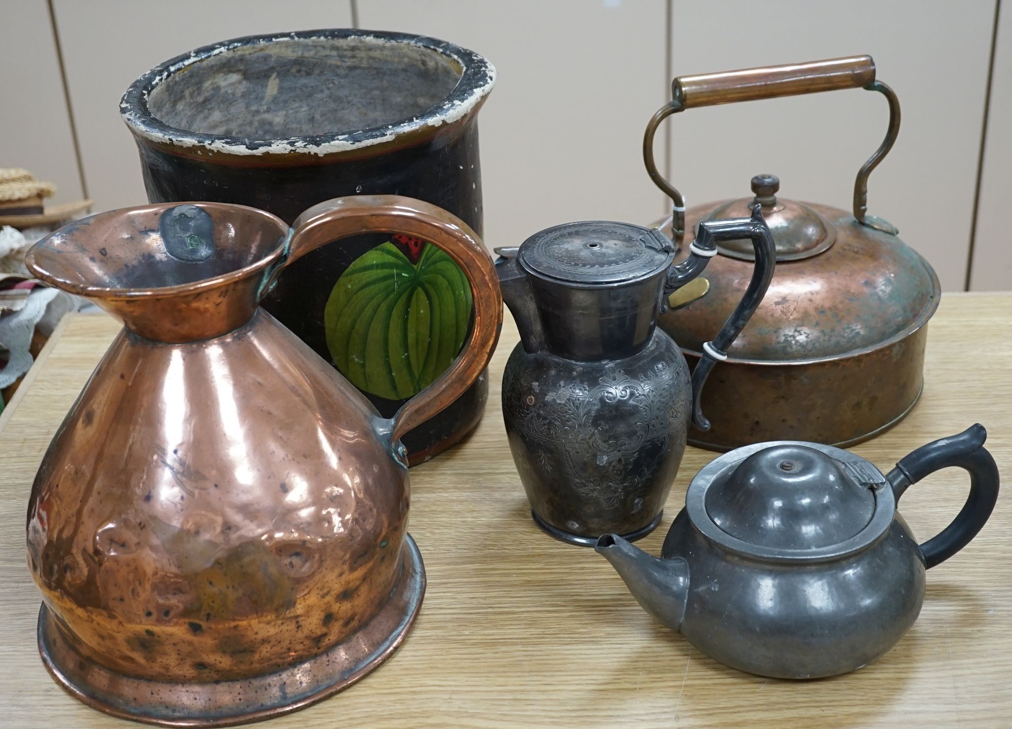 A Copper love token kettle, Georgian copper haystack measure, liberty & Co pewter teapot and a decorative papier mache bucket.